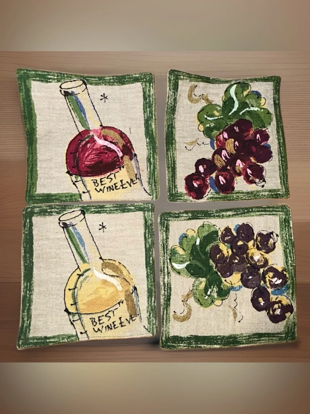 This set of 4 cloth coasters by Western Linen Inc. features a wine motif in a co